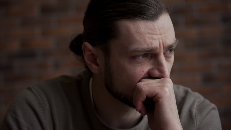 Worried man in the living room