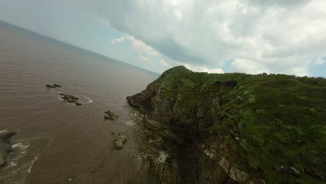 plage du ris rugged shoreline in douarnenez, brittany france. fpv shot