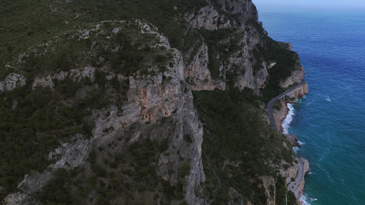 Rocky cliffs, Noli Cape, Liguria in Italy. Aerial drone orbiting