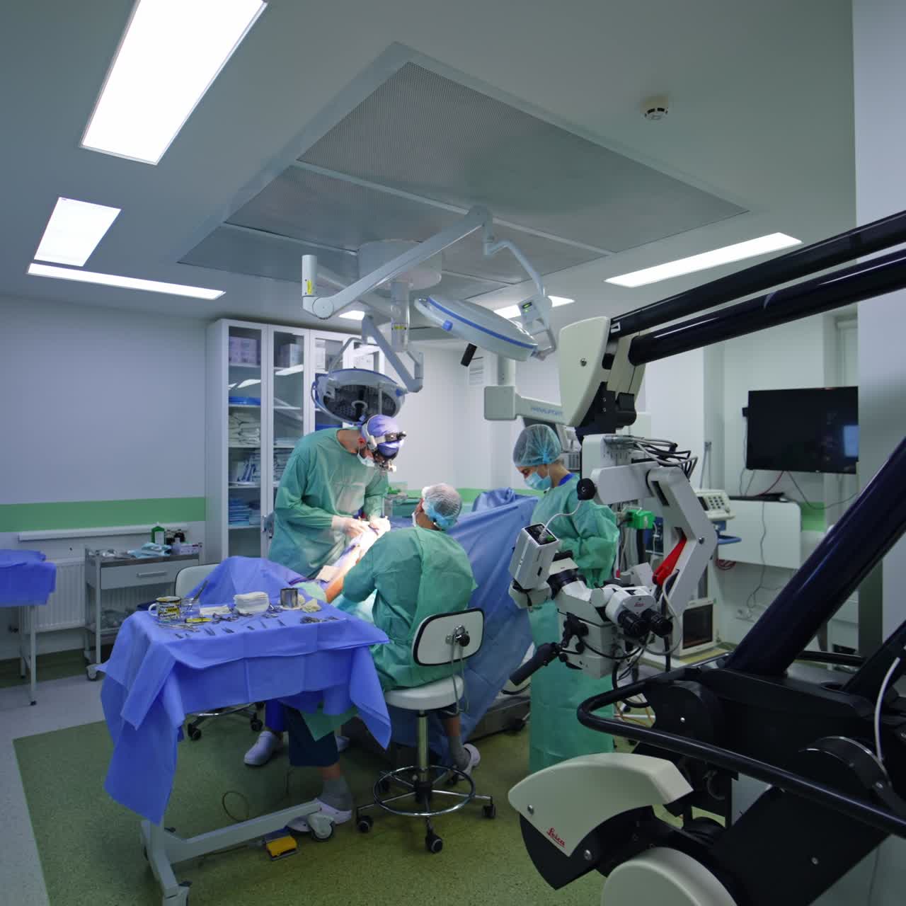 Modern surgery room with advanced equipment. Medical team of professionals conducting the surgical procedure