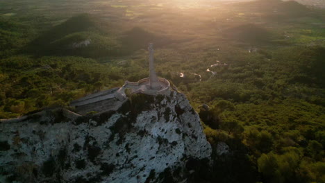 Pivoting-Aerial-view-of-Sant-Salvador-sanctuary-atop-a-cliff-in-Mallorca