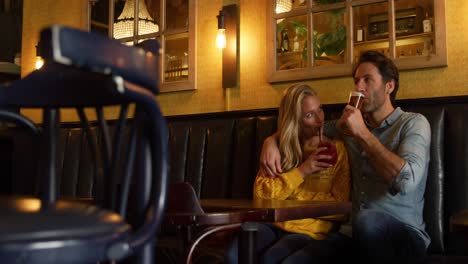 young couple in a bar together