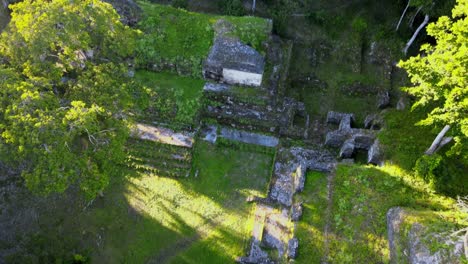 nakum guatemala, old mayan ruin in the jungle, archeological site, rotted pyramids