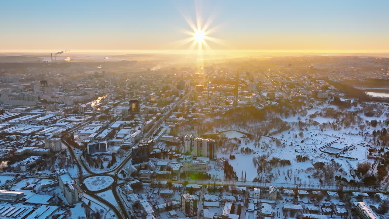 Aerial drone view of the city covered in snow. Sunrise during winter in Chisinau, Moldova