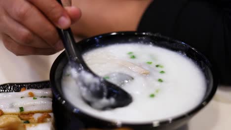 savoring a bowl of rice porridge