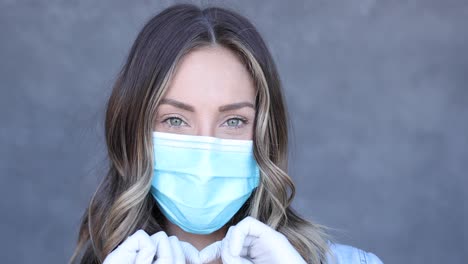 a cleared woman makes a heart shaped love sign during the covid19 coronavirus pandemic epidemic