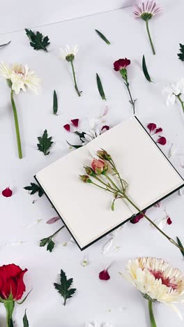 beautiful floral arrangement with open book