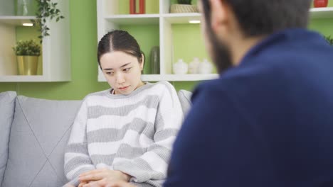 scared young asian woman from opposite side. danger delusion, agoraphobia.