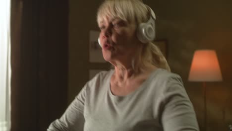 elderly woman listening to music during cardio workout