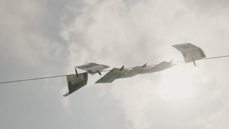 dollar banknotes dry on a clothesline. money laundering concept