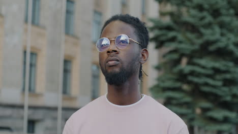 stylish man in pink sweatshirt