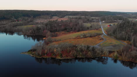 Aerial-view-Of-Lake,-Felds-and-Coastal-Forest