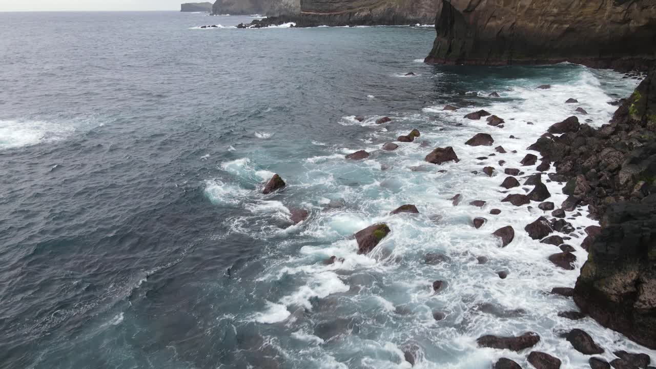 Waves hitting the shoreline of the Sao Miguel island in the Azores