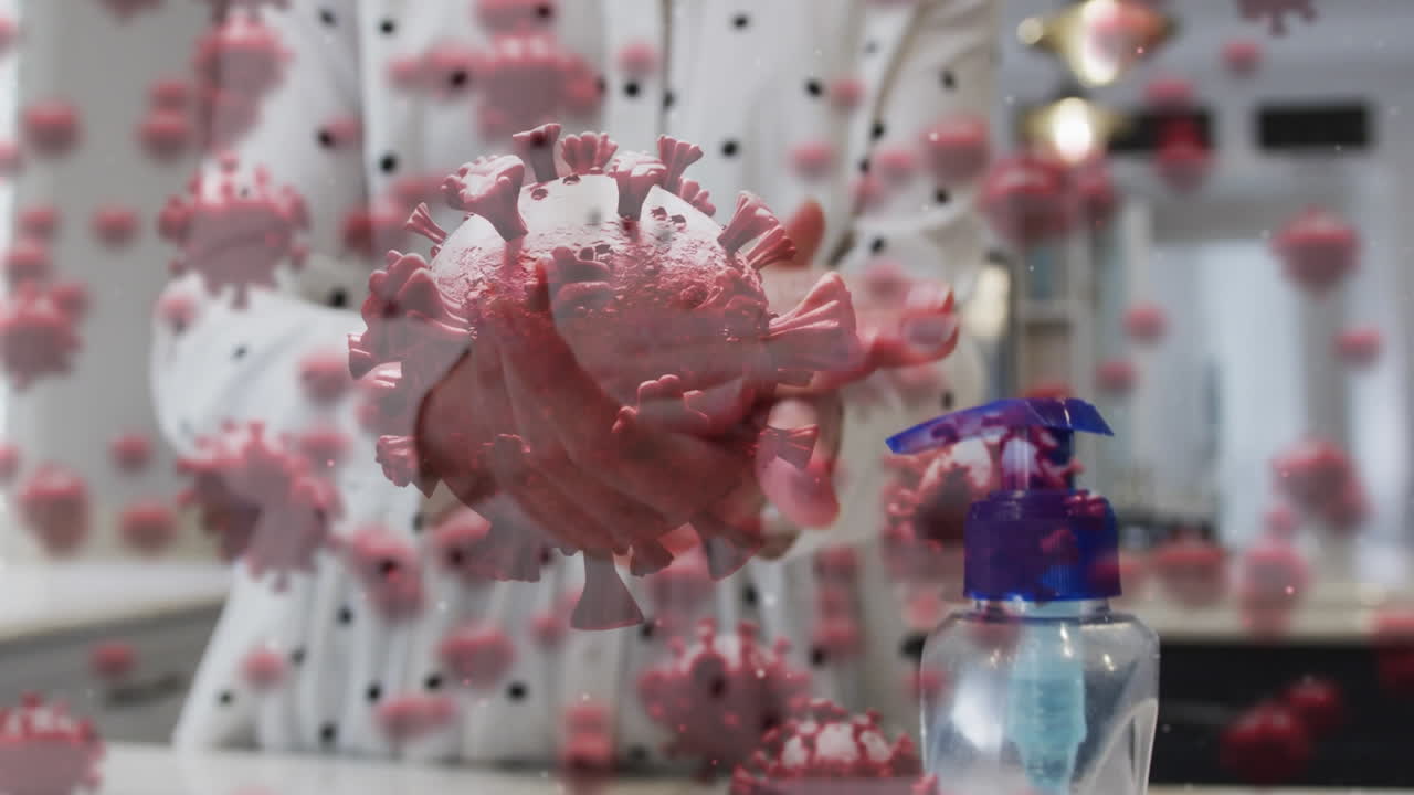 animación de células de covid 19 sobre una persona lavando las manos