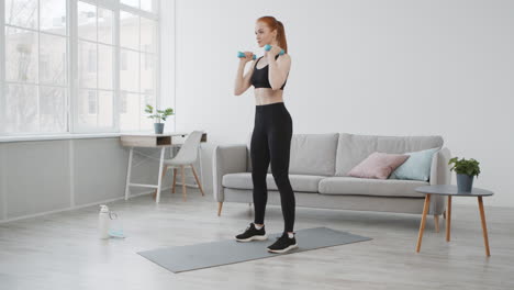 woman doing dumbbell squats at home