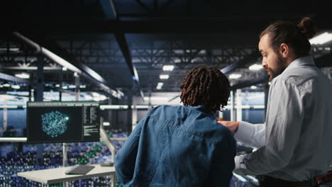 stressed technicians in server room fighting each other after hacking attempt