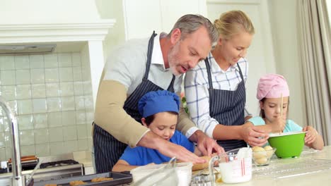 Family-preparing-dessert-in-kitchen