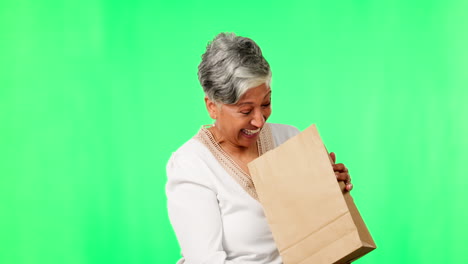 Shopping,-wow-and-a-senior-woman-on-a-green-screen