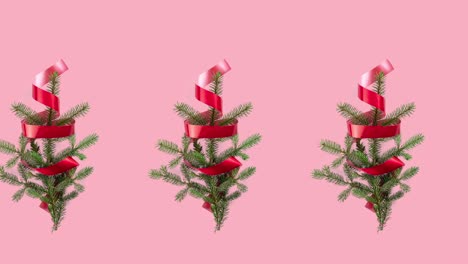 seamless pattern animation with many spruce branches and red curly ribbon. movement in one row direction. christmas tree and new year concept with copy space on pink pastel background