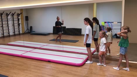 kids gymnastics class on air track