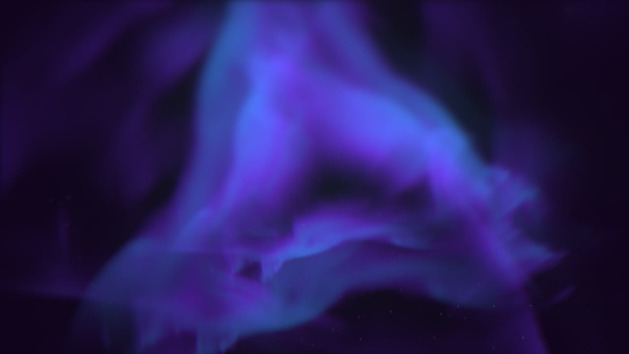 Vibrant purple and blue flame illuminates the darkness