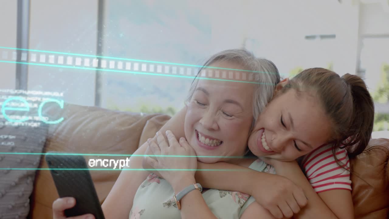 Mom sitting on couch receiving tech data on phone as daughter entering hugging warmly under overlay