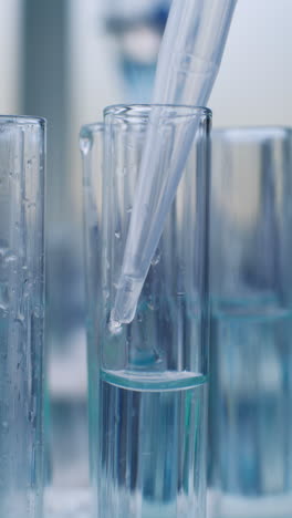 laboratory experiment with test tubes and pipette