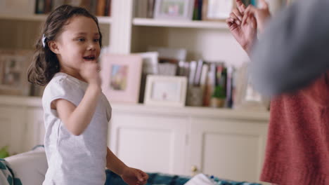 cute-little-girl-dancing-with-mother-at-home-family-having-fun-parents-playing-with-child-at-home-on-weekend