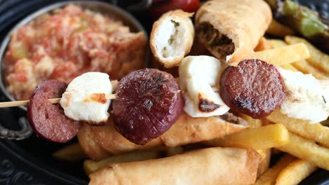 delicious turkish food platter with sucuk, cheese and fries