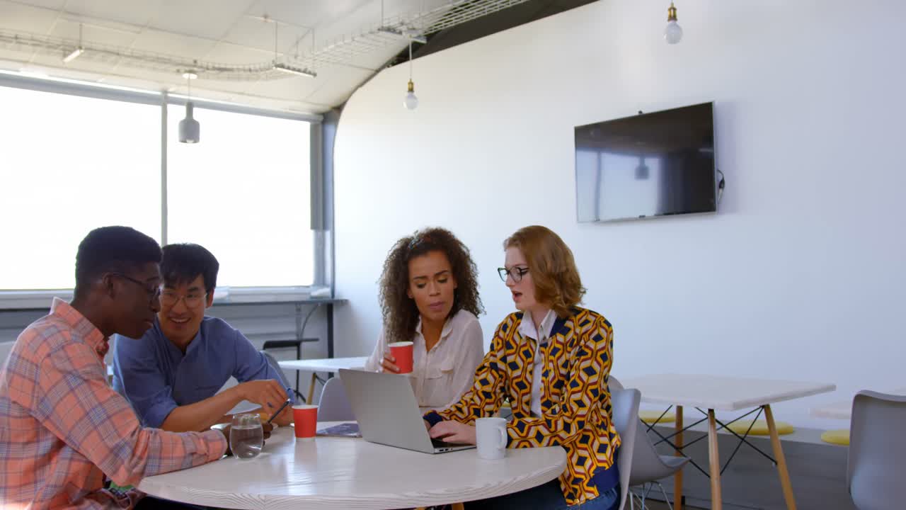 Multi-ethnic business people interacting with each other in modern office 4k