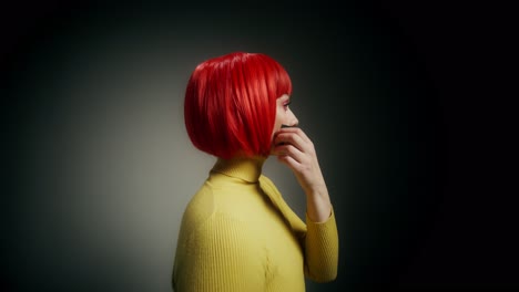 woman with red hair and duct tape over mouth