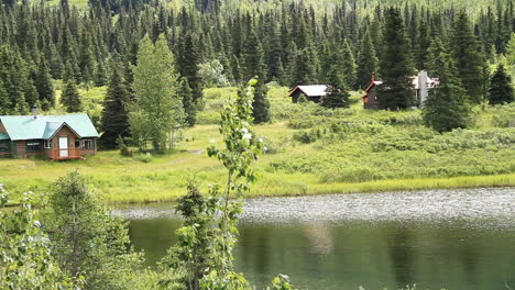 cabins sit along lake in alaska