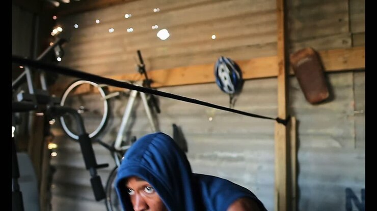 African American male boxer practicing boxing in fitness studio 4k
