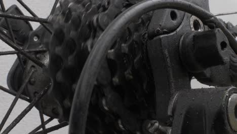 close up of rear dirty spinning bike cassette