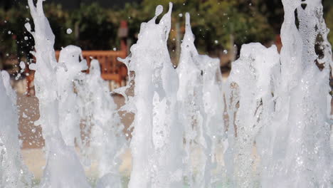 water fountain sprays water in daytime