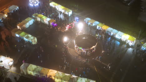 Drone-view-of-Christmas-stalls-and-carousel-on-the-Podgorski-Square-with-St