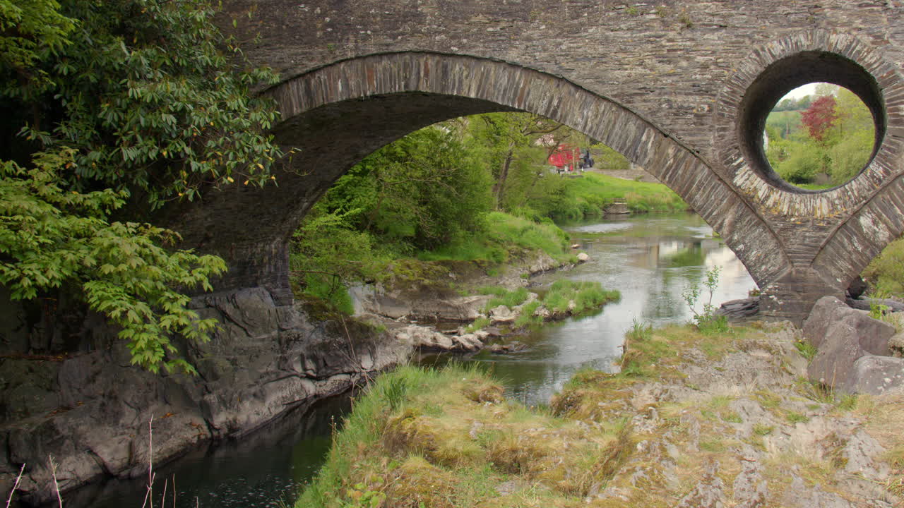 Mid shot of the Cenarth bridge arch that crosses the river Teifi at Cenarth Falls