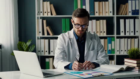 doctor working at desk in office