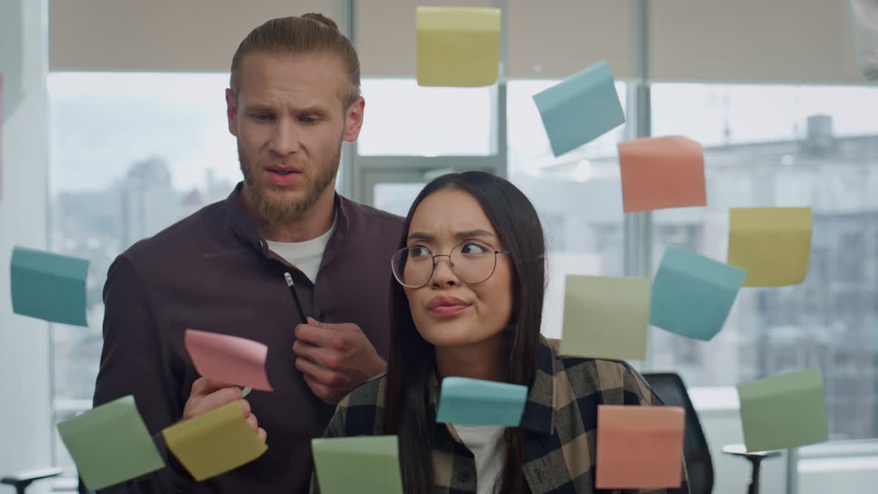 Sceptic colleagues talking transparent wall portrait. Startupers discussing