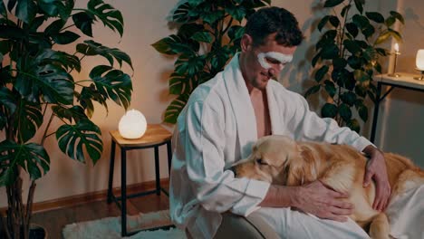 man with facial mask and golden retriever