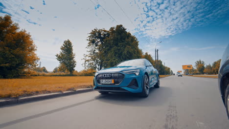 presentation of a blue audi e-tron, compact luxury crossover suv. modern new cars for sale