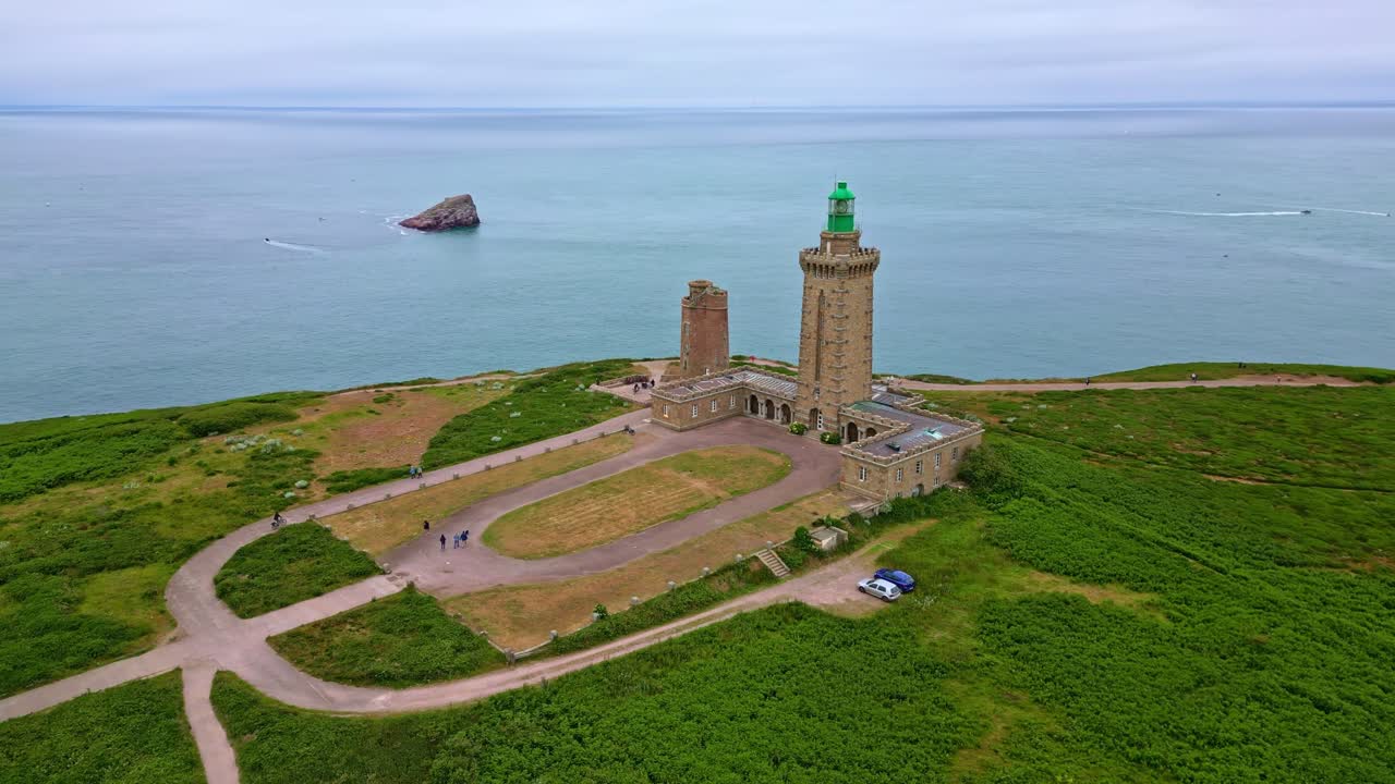 Panoramic drone movement around the Cap Fréhel peninsula lighthouse, Côtes-d'Armor, Brittany, France.
