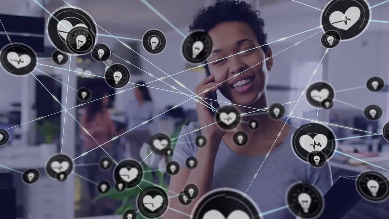 Animation of network of connections over african american businesswoman talking on smartphone