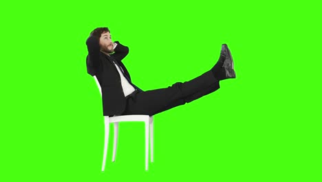 Businessman-relaxing-on-a-chair-with-legs-up