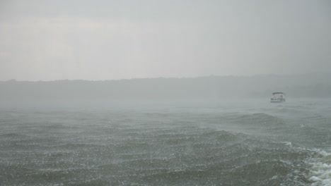 riding a boat as it speeds to safety during a rain storm on the water