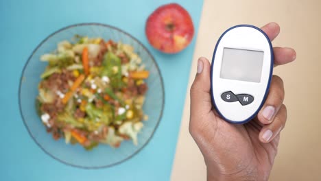 diabetes management: checking blood sugar and healthy meal