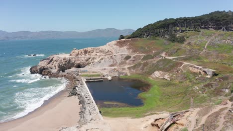 Panning-aerial-shot-of-the-ruins-of-the-Sutro-Baths-at-Land's-End-in-San-Francisco