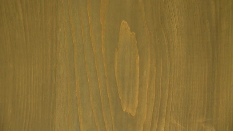 slow zoom-out of hinoki wood showing concentric grain pattern