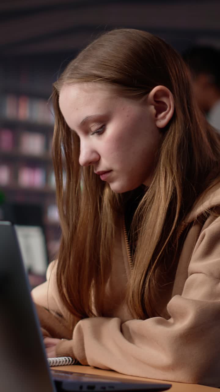 Vertical video university student does research on foreign affairs via primary source materials