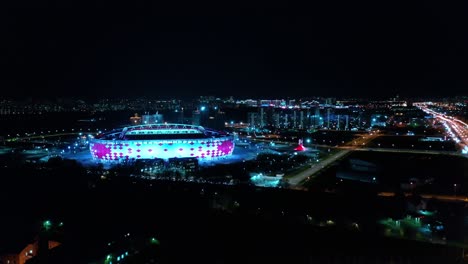 night aerial view of a freeway intersection and football stadium spartak moscow otkritie arena